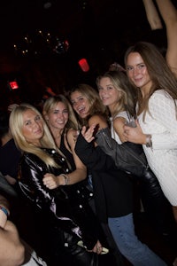 a group of women posing for a picture