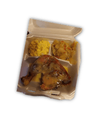 a tray with chicken, rice and gravy in it