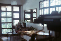 a woman sitting at a table in a restaurant
