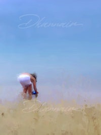 a girl is in the sand