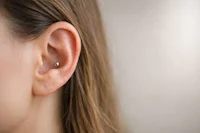 a woman with a piercing in her ear