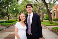 a young man and woman posing for a picture