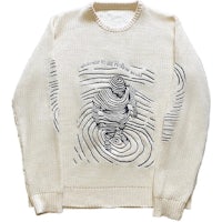 a white sweater with a drawing on it