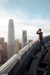 a man standing on a railing