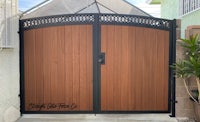 a wooden gate with a black and brown design
