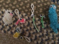 a group of yarn worms on a rug