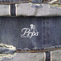 a pair of jeans with the word rips on them