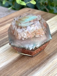 a glass container with sand in it