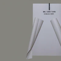a white sheet of paper hanging on a gray background