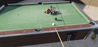 a pool table with a ball on it