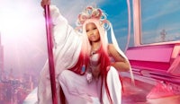 nicki minaj in a pink dress with a pole