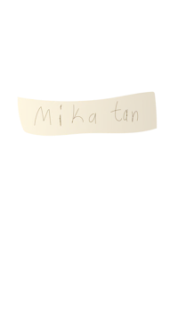 the word mika tan written in gold on a black background