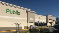 the front of a publix store with cars parked in front of it
