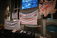 a group of banners on display in a room