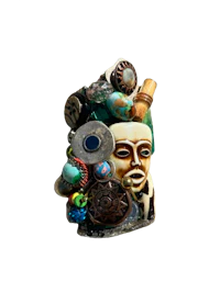 a ring with beads and a face on it