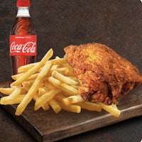 fried chicken and coke on a wooden cutting board