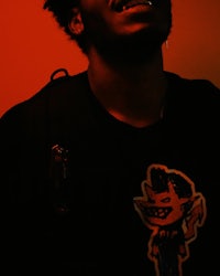 a man wearing a shirt with a devil on it