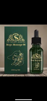 a bottle of magic massage oil next to a box