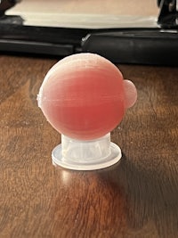 a pink plastic cup on a wooden table