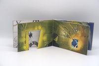 an open book with an image of a comic book