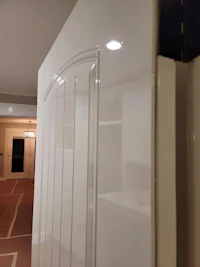 a close up of a white door in a room