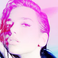 a woman with long hair is posing in front of a pink and purple background