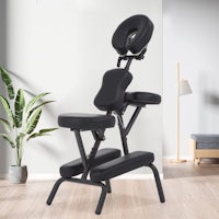 a black massage chair in a room
