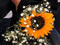a bouquet of sunflowers and baby's breath
