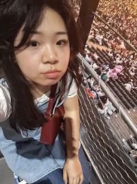 a girl taking a selfie at a concert