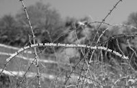 a black and white photo of barbed wire with a quote