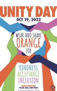 a poster for unity day with people holding hands