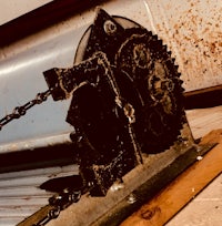 a rusty chain on a wall