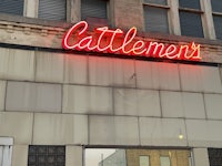 a building with a neon sign on it