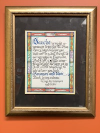 a framed piece of art with a quote on it