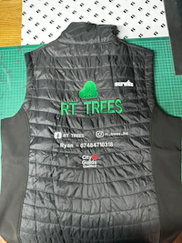 a black vest with the words rt trees on it