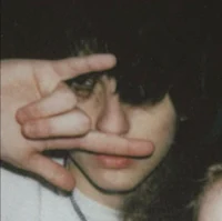 a man is making a hand gesture with his finger