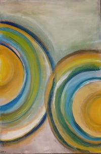 a painting of two yellow, blue and green circles