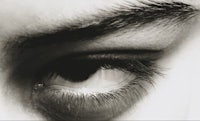 a black and white photo of a person's eye