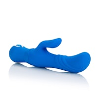 a blue sex toy lying on a white surface