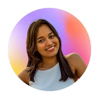 a young woman smiling in front of a colorful background
