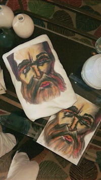 a painting of a man with a beard on a table