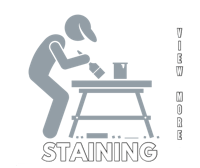 a black and white image of a man staining a table