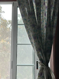 a window with a curtain on it