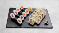 sushi on a black slate plate