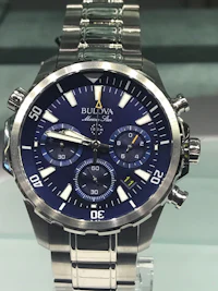 a men's watch on display in a glass display case