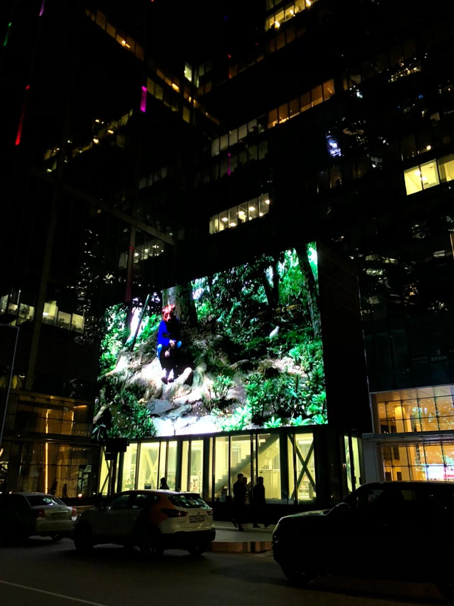 a large led screen in front of a building