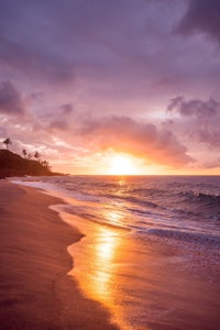 sunset on a beach in maui, hawaii