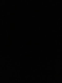 a black and white image of a plane flying in the sky