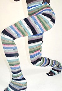 a woman in striped leggings posing for a photo