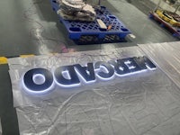 a large led sign with the word nebcdo on it
